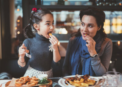 mom and daughter eating